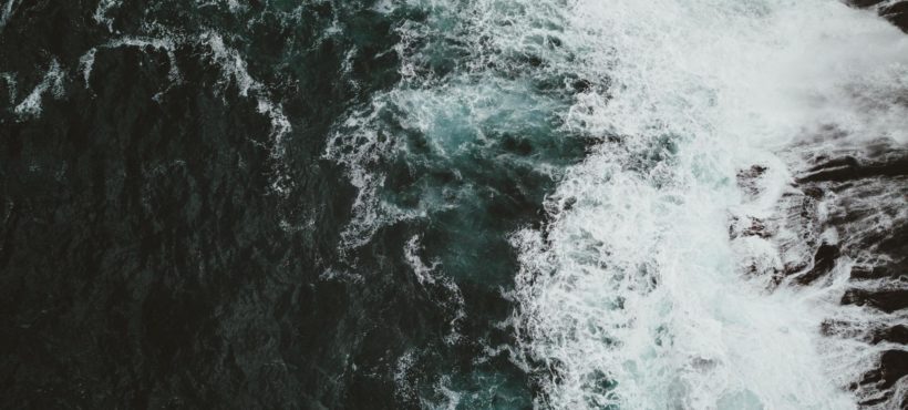 Waves Crashing Against Cliffs