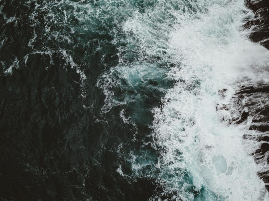 Waves Crashing Against Cliffs