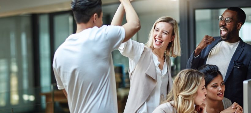 Colleagues High-Fiving Each Other